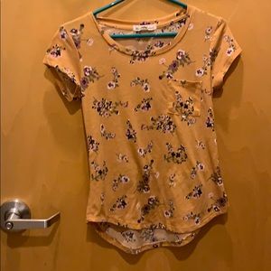 Yellow top with flowers. Nice material.